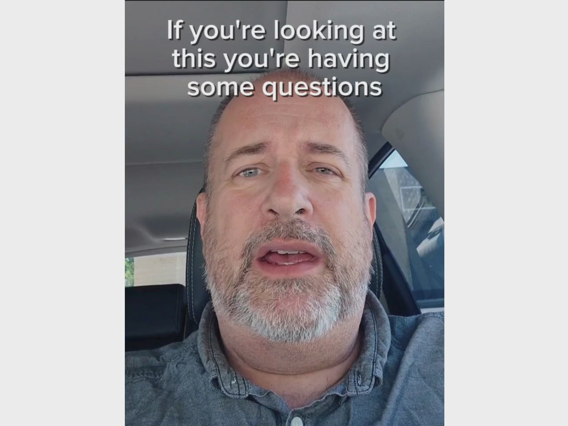 Man in blue shirt talking to camera about The Office Escape System